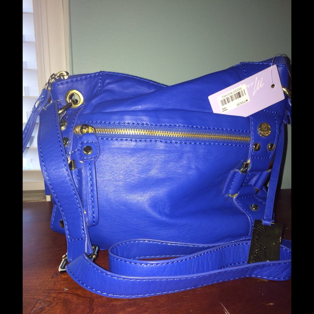 Gorgeous bright blue crossbody w brass detail.